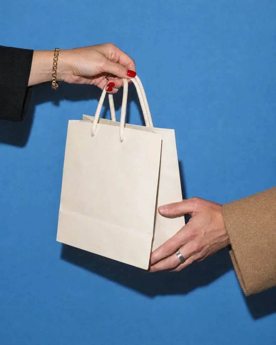 A shopping bag handed over
